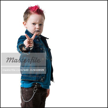 little boy making peace sign