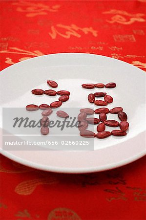 Chinese character for "fortune" formed with red melon seeds