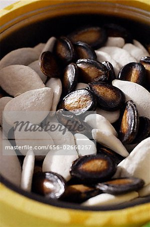 Still life of white and black melon seeds