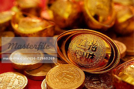 Still life of gold coins and ingots