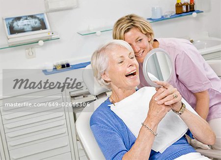 Dental assistant working on patient