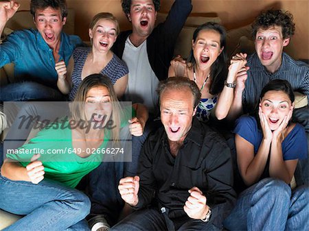 Group of friends watching television