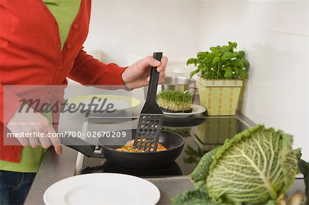 Woman Frying Salmon
