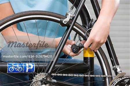 Man locking bicycle