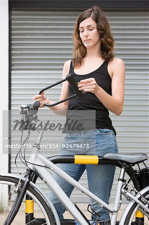 Woman with bicycle and lock