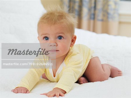 Baby Crawling on Bed.