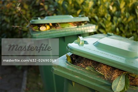 Garbage cans filled with compost