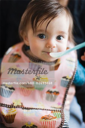 Baby Girl Tasting Solid Food For the First Time