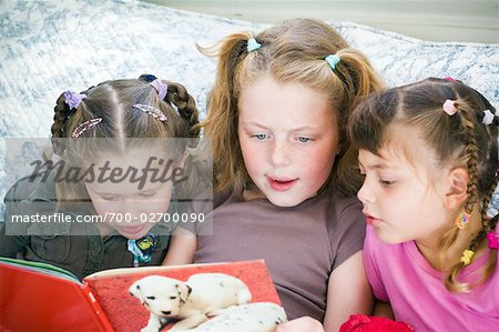 Girls Reading Book Together
