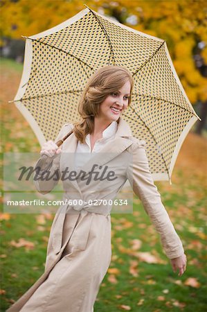 Woman With an Umbrella Walking in the Park, Portland, Oregon, USA