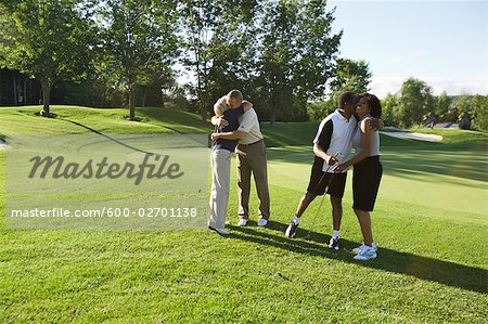 Couples Hugging on Golf Course, Burlington, Ontario, Canada