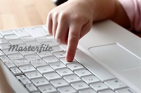 Girl's Hand on Keyboard