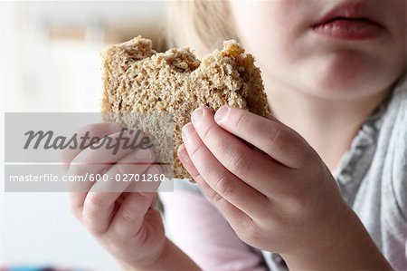 Girl Eating Peanut Butter Sandwich