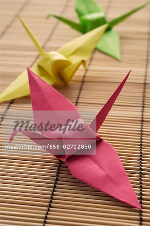 pink, yellow and green paper cranes