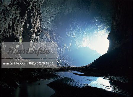 Tiny figures show scale of the Deer cave looking back to mouth of the Deer cave, Mulu National Park, Sarawak, island of Borneo, Malaysia, Southeast Asia, Asia