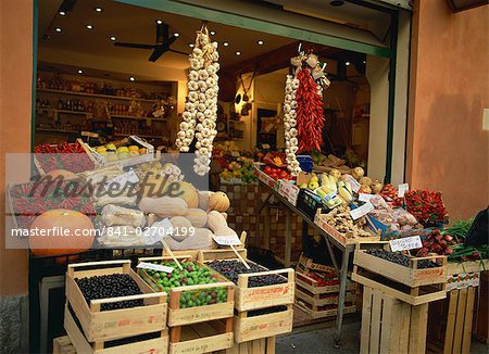 Vegetable shop selling garlic, olives and squash, in the market in Bologna, Emilia Romagna, Italy, Europe