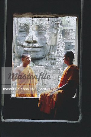 Buddhist monks at the Bayon temple, Angkor, UNESCO World Heritage Site, Siem Reap, Cambodia, Indochina, Asia