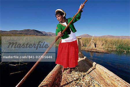 Portrait of a Uros Indian woman on a traditional reed boat, Islas Flotantes, floating islands, Lake Titicaca, Peru, South America