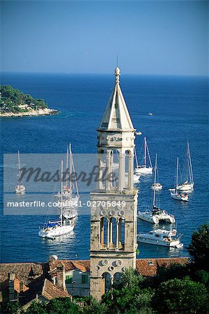 Church spire and boats in the harbour, Hvar Town, Hvar Island, Dalmatia, Dalmatian coast, Croatia, Europe