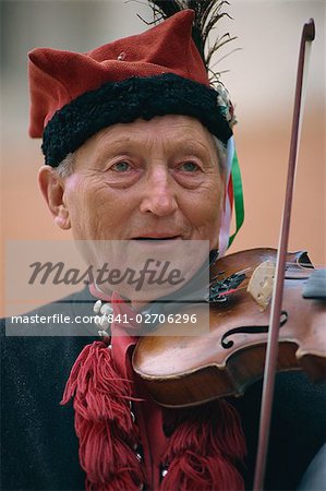 Musician in national dress, Krakow, Poland, Europe