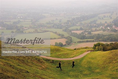 Tow children running down path, British Camp, Hereford Beacon, Malvern Hills, Herefordshire, Midlands, England, United Kingdom, Europe