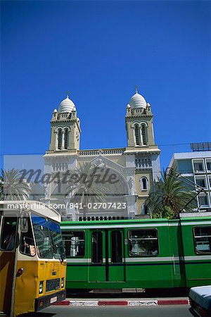 Cathedral with bus and tram in foreground, Tunis, Tunisia, North Africa, Africa
