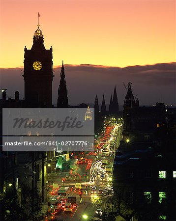 Aerial view over Princes Street at dusk, including the silhouetted Waverley Hotel clock tower, Edinburgh, Lothian, Scotland, United Kingdom, Europe