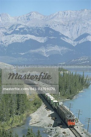 Canadian National Railways goods train along Athabasca River, Jasper National Park, UNESCO World Heritage Site, Alberta, Rocky Mountains, Canada, North America
