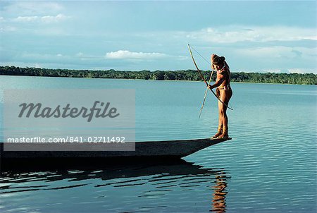 Indian fishing with bow and arrow, Xingu, Amazon region, Brazil, South America