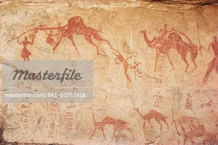 Rock art of Tuaregs with camels, Tassili, Algeria, North Africa, Africa