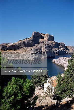 St. Pauls Bay looking towards Lindos acropolis, Lindos, Rhodes, Dodecanese islands, Greece, Europe