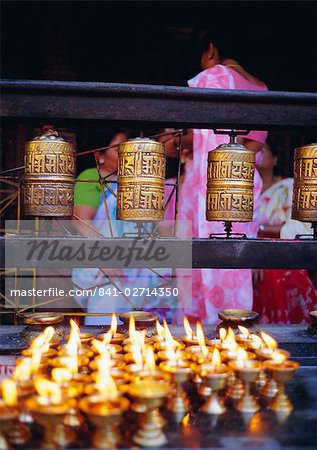 Lamps and prayer wheels, Gold Temple, Patan, Kathmandu Valley, Nepal, Asia