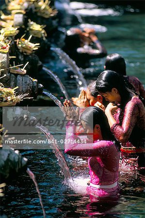 Young women at Tirta Empul temple, Ubud region, island of Bali, Indonesia, Southeast Asia, Asia