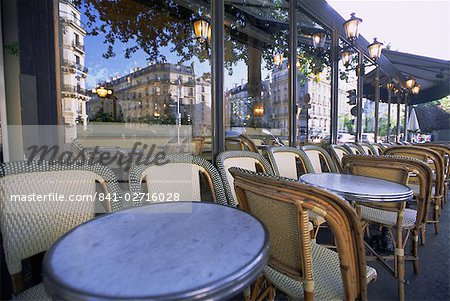 Chairs and tables at a cafe, Paris, France, Europe