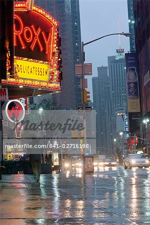 Times Square in the rain at night, New York City, New York, United States of America, North America