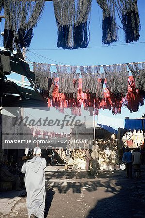 Skeins and cloth hanging in the souk, Marrakech, Morocco, North Africa, Africa