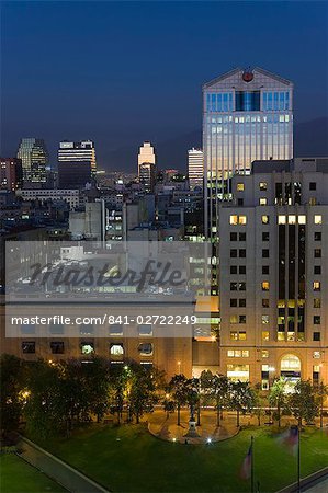 Elevated view of the central city skyline at dusk, Santiago, Chile, South America