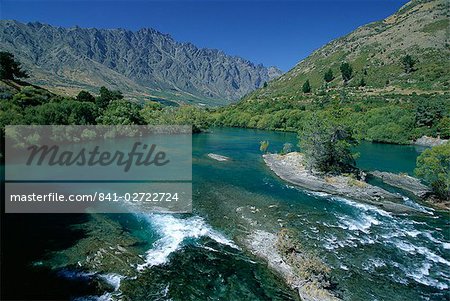 The Kawarau River, the outflow of Lake Wakatipu at Frankton, near Queenstown, with the Remarkables beyond, Otago, South Island, New Zealand, Pacific