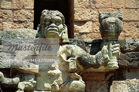 The Mayan rain god Chac, holding burning torch showing his power to withhold or dispense rain, in west court of the Mayan ruins at Copan, UNESCO World Heritage Site, western highlands, Honduras, Central America