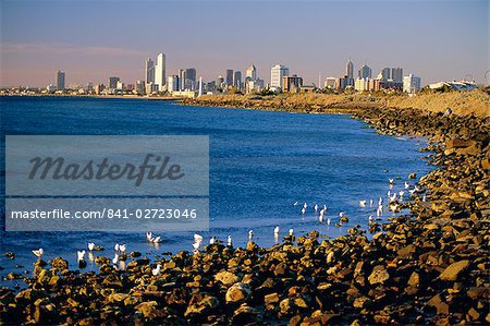 Seafront in the suburb of Saint Kilda looking towards the Melbourne city skyline, Melbourne, Victoria, Australia