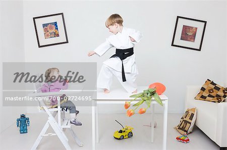 Boy on Table in Karate Pose