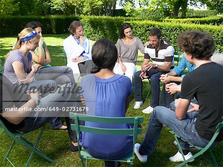 Circle of people in rehab,  outdoors