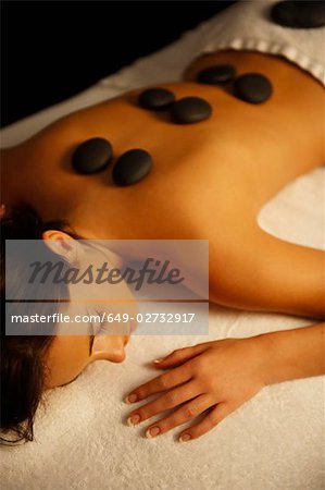 Woman receiving hot stone massage