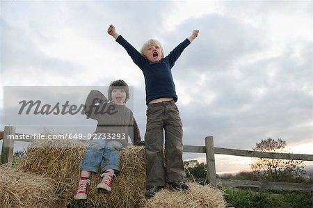 Young boys on hay bales