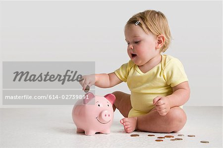 Baby with piggy bank