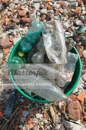 Discarded plastic bottles in garbage can