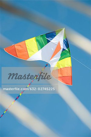 Colorful kite in midair, low angle view