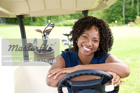 Portrait of Woman Sitting in Golf Cart