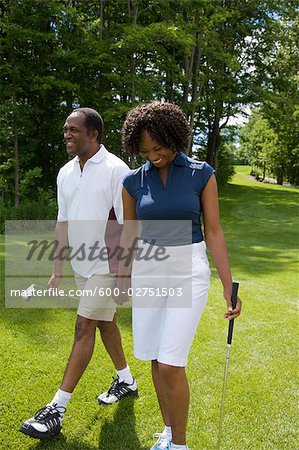 Couple Walking on Golf Course