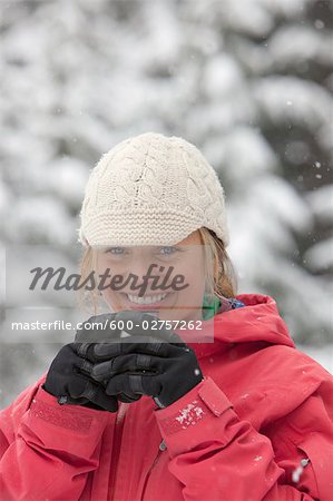 Close-up of Woman Drinking Beverage Outdoors in Winter, Whistler, British Columbia, Canada